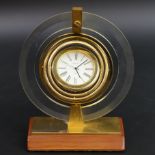 Bulova binnacle design gilt metal, Perspex and wood, quartz movement mantle clock. 15.5cm high. UK