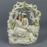Victorian Staffordshire pottery figure group of a courting couple. 24 cm high. UK Postage £15.