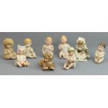 Victorian and later porcelain Piano Baby's. Tallest 13 cm. UK Postage £20.