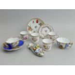 Five Dresden floral porcelain cups, two saucers, a plate and a floral encrusted shoe. Shoe 14 cm