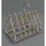 A silver plated rifle design toast rack. 12 cm high x 11 cm long. UK Postage £15.