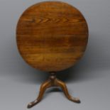 Georgian oak oval tilt-top tri-pod table. Top 76 cm x 67 cm. Collection only.