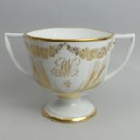 Early 19th century English porcelain twin handled loving cup, circa 1825. 26 cm wide x 17 cm high.
