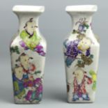 A decorative pair of Chinese pottery vases. 25 cm high. UK Postage £20.