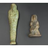 Two Egyptian tomb figures, one Ushabti and one of a figure holding a goat. 10cm and 19 cm. UK