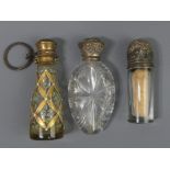 Three Victorian scent bottles, one silver topped, Birmingham 1893, one cut crystal and one