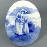 Royal Doulton blue and white pottery wall plaque no.20, depicting a mother with her child. 35.5 cm x