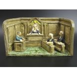 A Chelsea art Pottery signed Courtroom figure group. 23.5 cm wide x 13 cm high. UK Postage £20.