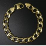 Heavy yellow metal curb link gents bracelet. 58 grams. 215 mm x 11 mm. UK Postage £12.