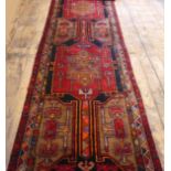 Hand woven, heavy pile, large Iranian runner with unusual colouring and a geometric medallion