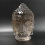 A well carved rock crystal Buddhas head. 20 cm high. 3.7 kg. UK Postage £20.