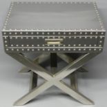 A chrome studded side table with a single drawer. 61 cm wide x 41 cm deep x 64 cm high.