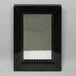 Black glass framed bevelled mirror with crystal decoration. 102 cm x 67 cm.