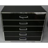 A black, chrome and silver chest of five drawers. 96 cm wide x 42 cm deep x 87 cm high.