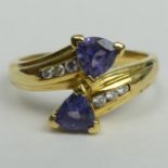 18 carat gold Tanzanite and Diamond ring size S. Top 12.8 mm, band 2.7 mm. 6 grams. UK Postage £12.