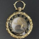 Victorian yellow metal and enamel memorial locket, 17.3 grams. 35 mm diameter x 50 mm long. UK