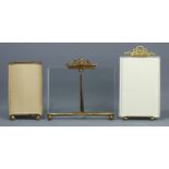 Three Victorian/Edwardian gilt metal and bevelled glass photo frames, with easel backs. Tallest 17.5