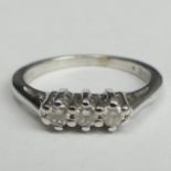 9 carat white gold three stone diamond trilogy ring (.25ct), 3 grams. Size L, top 4.3 mm band 1.8