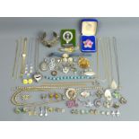 A box of various jewellery including a silver scarab pendant, stone set white metal bangle, stone