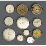 A box of eleven watch movements including Girard Perregaux, Longines and Hamilton. UK Postage £12.