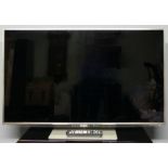 A Panasonic Viera 48" television with remote. Model n0. TX-L47DT50B.