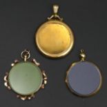 Two 9 carat gold picture locket pendants and one yellow metal example. 30 mm, 33 mm and 35 mm in