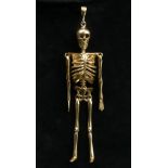 9 carat gold skeleton design articulated pendant. 10 grams. 8 cm. UK Postage £12.