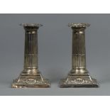 A pair of Victorian silver weighted dwarf candlesticks, Sheffield 1897. 13.5 cm. 555 grams. UK