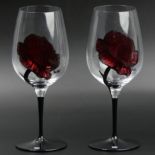 A pair of Kosta Boda hand painted Rose design wine glasses. 23.5 cm high. UK Postage £16.