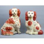 Two large Staffordshire type pottery spaniel dog figures. 35 cm. UK Postage £20.