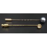9 carat gold diamond set stick pin and a tinted pearl example. 2.8 grams. Pearl 8.7 mm, diamond 2.