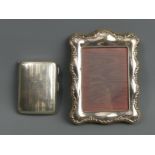 George V silver cigarette case, Birmingham 1924, 64 grams and an ornate silver plated photograph