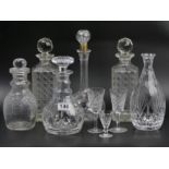 Various cut crystal decanters and glasses, including Waterford and Stuart examples. 29 cm tallest.