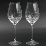 A pair of Dartington crystal mounted wine glasses. 23 cm high. UK Postage £15.