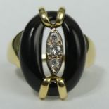 Vintage 18 carat gold black onyx and diamond ring, London 1975. 6.7 grams. Size N, top 19.3 mm, band