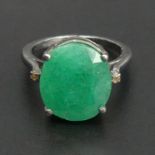 Sterling silver and Emerald (9.1ct) and Diamond ring, 4.8 grams. Size N 1/2, top 14.3 mm, band 1.8