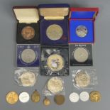 Commemorative medallions and coins, including 1910-1935 George V medallion in the original box. UK