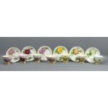 A set of six Paragon 'Rendezvous' bone china Roses design tea cups and saucers along with a sugar