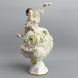 Rudolstadt German porcelain figurine of a dancing lady wearing a crinoline lace dress. UK Postage £