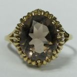 9 carat gold smokey quartz single stone ring, size Q, top 15.5 mm, band 1.7 mm. 2.9 grams. UK