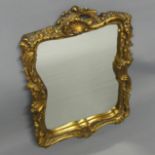 Ornate gilt framed wall mirror. 37 x 56 cm. Collection only.