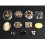 A collection of silver and gilt metal brooches, including micro-mosaic examples. Largest 60 mm. UK