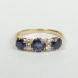 14 carat gold sapphire and diamond ring, 2.5 grams. Size Q, 5.5 mm wide. UK Postage £12.