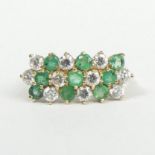 9 carat gold emerald and white stone dress ring, London 1990, 2.4 grams. Size J, top 9.2 mm. UK