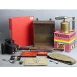 Two Kodak Instamatic cameras, brass blow torch, display case, military items, a carving set and a