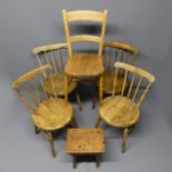 Four Victorian stick back kitchen chairs, a knife back example and a pine milking stool.