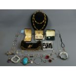 A box of costume and silver jewellery including rings and brooches. UK Postage £15.