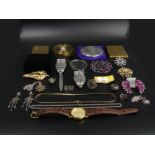 A box of costume jewellery and compacts, including an owl design magnifying glass, earrings and