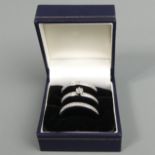 Sterling silver three ring set, one with diamonds, 8 grams. Size T 1/2. UK Postage £12.