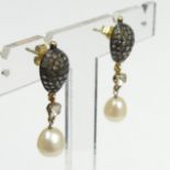 14 carat gold and white metal diamond and cultured pearl drop earrings, 5.6 grams. 8.8 mm x 35 mm.